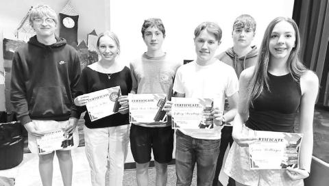 Megan Bickel presented English awards to these high school students (L-R): Carsen Sandquist, Peyton Keller, Juan Sosa Acevedo, Jeffery Stradinger, Kolby Holzer, Geana Bollinger
