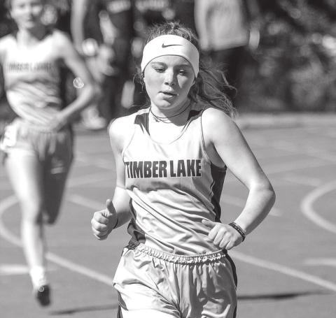 Timber Lake’s Kenlea Heck runs in the 400 meter race at TL’s early track meet File photos by Jon Flatland