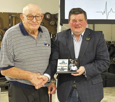 Bob Schuh (left) and his wife Dorothy of Isabel were recipients of the 2025 Good Neighbor award, presented by Ryan Maher, chairman of the Moreau-Grand board. Dorothy was unable to attend as she was recovering from surgery.