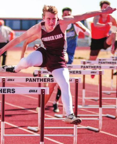 Timber Lake hurdler Gracen Hansen runs in the 300 hurdles. Photo by Jon Flatland