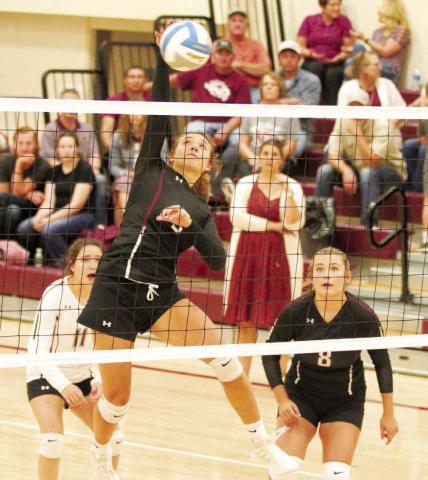 Timber Lake senior middle hitter Shay Kraft hammers a spike toward the Cheyenne-Eagle Butte Lady Braves during their matchup in Timber Lake last Tuesday, Aug. 30. Looking on are Kenna Webb (8) and liberio Abby Linderman (11). Photo by Jon Flatland