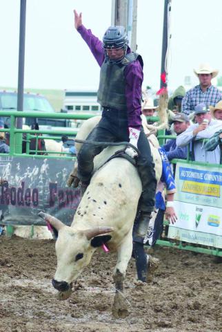 Timber Lake’s Chazz Gabe battles a bull at the Isabel Rodeo on Saturday, August 2, but was eventually bucked off. Gabe is currently fifth in the Northwest Ranch Cowboy Association (NRCA) bull riding standings. Photo by Jon Flatland