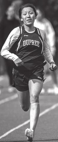 Charly Etzkorn sprints in the 100 meters in a meet earlier this season. Photo by Robert Slocum
