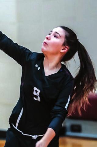 Abby Linderman makes a serve.