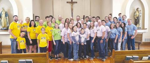 The Robert and Grace Alley children held a family reunion in Isabel on August 1 with 44 members present. This is the first time all the siblings have been together with their children and grandchildren. All 11 siblings graduated from Isabel High School along with their mom, Grace Whitehead Alley, and Mary's four children. Pictured are: Patty's family in yellow; John's family in green; Mary's family in purple; Tim's family in blue; back row, Bob in grey and Mark in green.