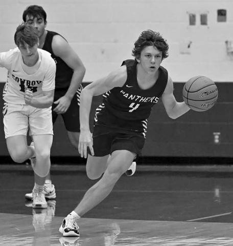 Panther guard Broc Bauer pushes the ball upcourt on a fast-break during varsity boys hoops action. Bauer poured in a game-high 22 points to lead the Timber Lake JV squad over Mobridge-Pollock. Topic photo by Marie DuPreez