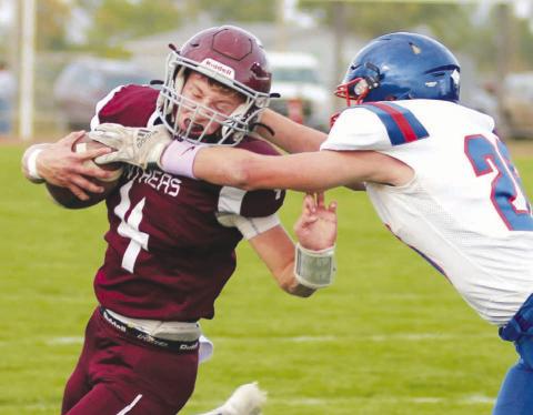 Timber Lake quarterback Gracen Hansen grimaces as he takes a high hit from Jones County linebacker Adrick Schoon during the Panthers 46-6 win over the Coyotes last Friday at Doug Kraft Field. Hansen finished the contest with three touchdown passes to go along with a TD run. Timber Lake, 4-1, travels to Faith to take on the 4-1 Longhorns on Friday, Sept. 23. Photo by Jon Flatland