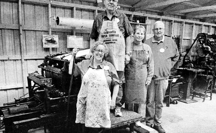 Standing with the 1895 Babcock cylinder press at the South Central Threshing Association’s historic print shop at Braddock, ND, are left to right, Prof. Lucy Ganje of the University of North Dakota, Grand Forks, Art and Lois Heinrich of Box Elder, and Roger Bailey, Executive Director of the North Dakota Newspaper Association, Bismarck, ND.