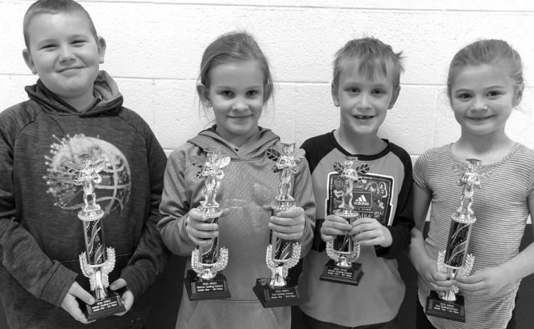 Timber Lake first and second grade trophy winners are (L-R): Brayden Meier, 1st in written; Brynn Lemburg, 2nd in oral and 3rd in written; Mason Hollenbeck, 4th in written; and Alexa Roggow, 1st in oral.