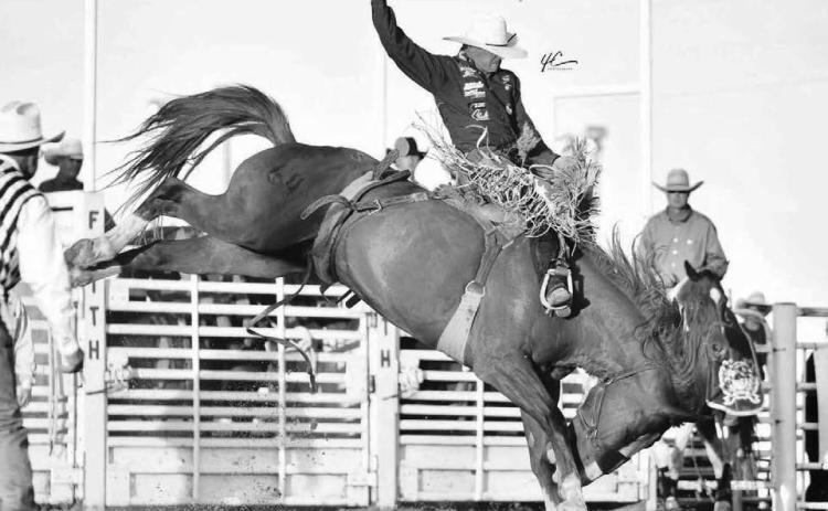 Shorty Garrett of Dupree shows his form while competing in the saddle bronc riding event at a recent rodeo. Garrett is the current leader in the PRCA’s Badlands Circuit standings and is ranked 25th overall in the world. Photo courtesy of Chuck Miner