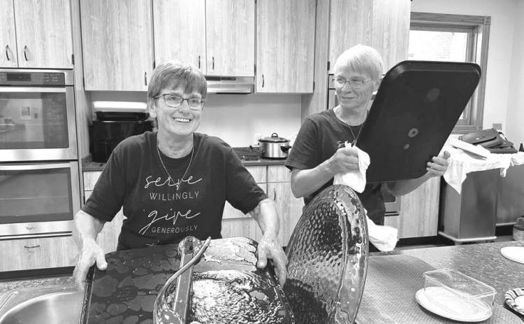 Holy Cross Catholic Church hosted its annual bazaar on Sunday, September 13, with a meal, games, and silent auction. Afterwards there was cleaning up to do. Renee Leibel (left) and Donna Aberle helped with the dish washing.