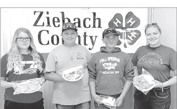 Winners of the Ziebach County Cookie Contest were (L-R) Trinity Leithauser, first place; Wyatt Lemke and Maverick Lemke, tied for second place; and Erin Lemke, third place. Gail Stambach and Bev Birkeland were the judges.