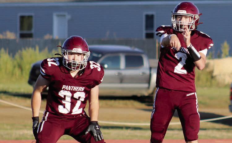 Timber Lake quarterback Cole Ducheneaux (2) fires a pass over the middle while running back Gabe Keller (32) stands guard in pass protection. Ducheneaux threw for two touchdowns and ran for another as the Panthers got past North Central 20-6 last Friday at Kraft Field.
