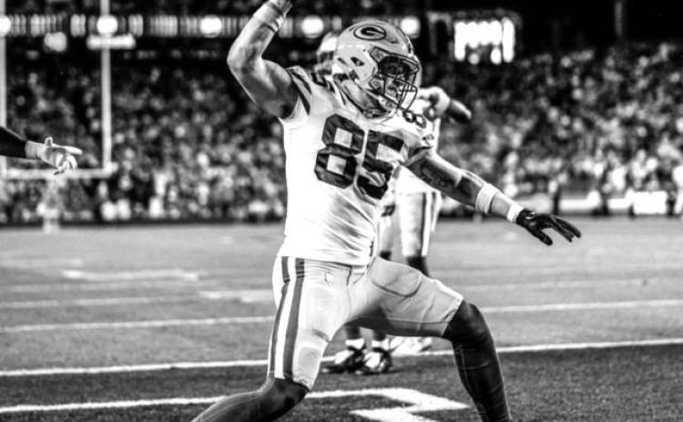 Tucker Kraft celebrates by spiking the football after pulling in a two-yard touchdown catch from quarterback Jordan Love during the third quarter of the Packers playoff matchup against San Francisco on Saturday. The game culminated a tremendous rookie season for Kraft, a native of Timber Lake. Photo courtesy of Green Bay Packers