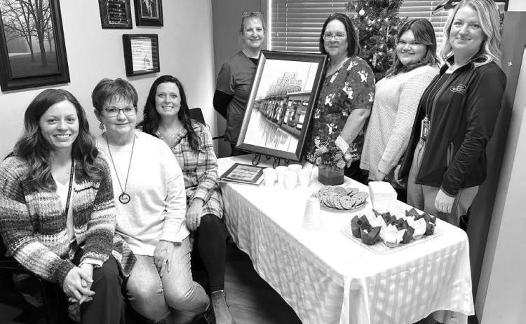 Kris Lawien was the guest of honor at an open house celebrating her retirement at West Dakota Health Center in Timber Lake on December 5. Staff from WDHC and Mobridge Regional Hospital were on hand to observe the special day. L-R are Nicole Schneider, Kris, Candida Goehring, Carol Geditz, Holly Keller, Mersedes Rough Surface, and Jodi Madison.