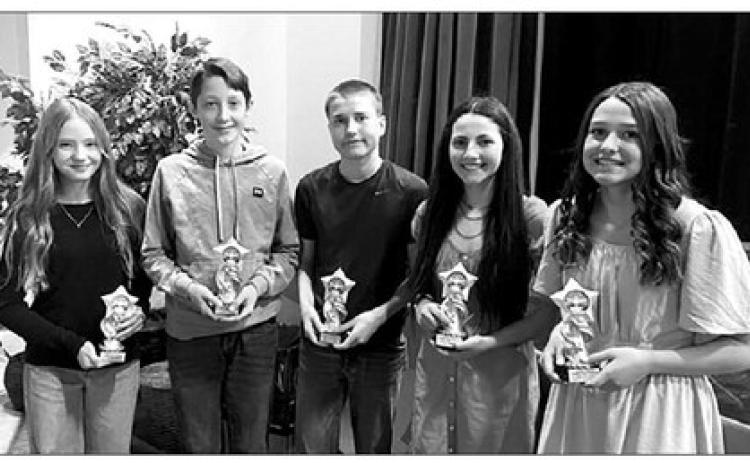 Timber Lake Middle School students who earned a 4.0 (A) average for the 2022-23 school year received trophies at Awards Day on May 3. L-R are Grade 6 - Marcella Handeland; Grade 7 - Landen Bieber; and Grade 8 - Thomas Holzer, Ruby Maher and Jaylee Schoelerman.
