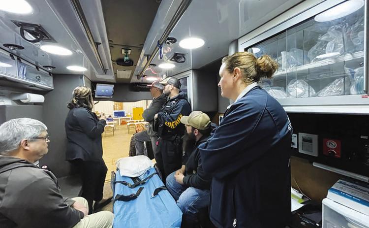 The Timber Lake ambulance crew listens to trainer Sarah Barch, left, during a March 28 training session on the new Avel equipment installed in the ambulance. The equipment remotely connects EMT’s to medical professionals at a virtual health care center in Sioux Falls.