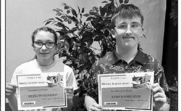L-R: Bricelyn Pederson and Evan Schweitzer received the Middle School Band Excellence Awards presented by music teacher Walker Rose.
