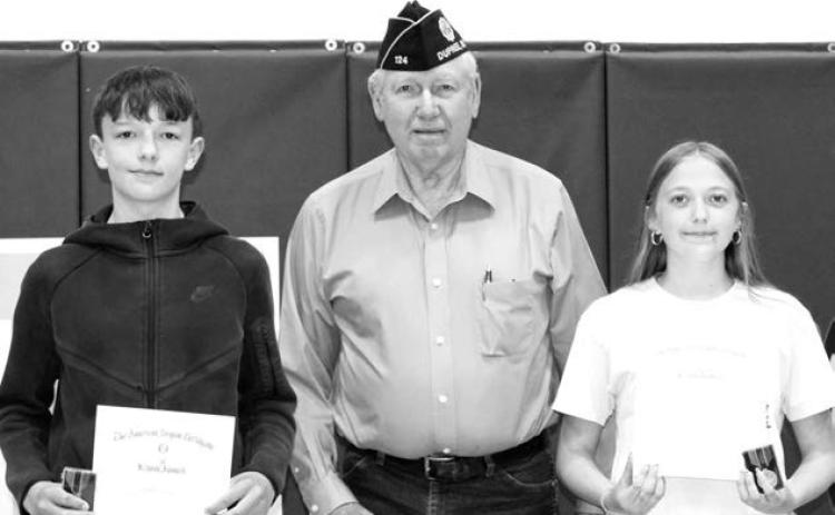 RIGHT: John D. Lemke presented the American Legion 8th Grade Citizenship awards to Walker Farlee and Kyler Hunt.