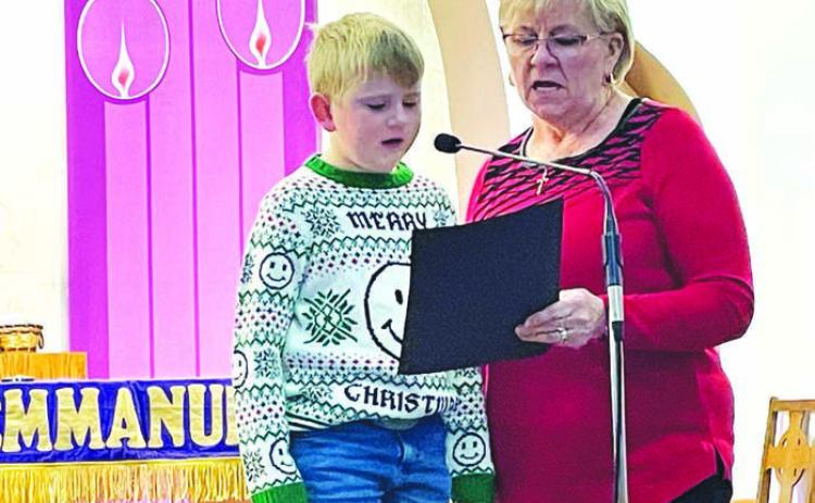 Ann Crance and grandson Isaac Schweitzer sang “The Little Drummer Boy” accompanied by Sarah Schweitzer on piano, Evan Schweitzer on drums, and Owen Schweitzer on guitar.