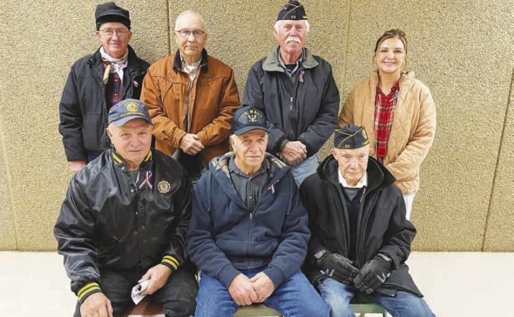 Six local veterans and one active duty member were recognized at the Veterans Day program held at the Timber Lake School on November 8. FRONT (L-R): John D. Boldt, Val Schweitzer, Andy Aberle; BACK: Keith Dorsey, Larry Gill, Jack Bickel and Veronica Handeland (active duty with the U.S. Public Health Service Commissioned Corps.)