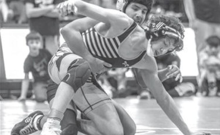 Junior Carmine Crow Ghost tries to work free from an opponent during the 2023 LNI Wrestling Tournament in Rapid City last week. Crow Ghost finished runner-up at 138 pounds. Photo by Robert Slocum