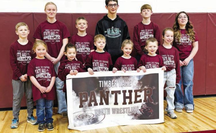 Timber Lake wrestlers who qualified for the State AAU tournament. FRONT, l-r:Lyllian Tesch, Ramzi Veit, Ryder Spiel, Rowan Maher, Trevor Aberle, Elizabeth Keller; BACK: TK Paxton, Emily Gill, Keaton Jones, Levi Berndt, Taggen Paxton, Selena Longbrake. Photo by Kathy Nelson