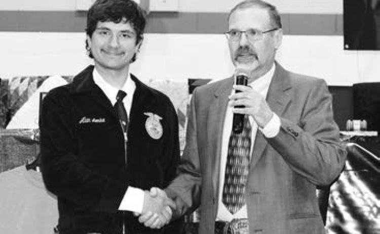 Alan Lemke (LEFT) receiving the Dekalb Senior Ag Accomplishment Award from Advisor Doug Hofer.