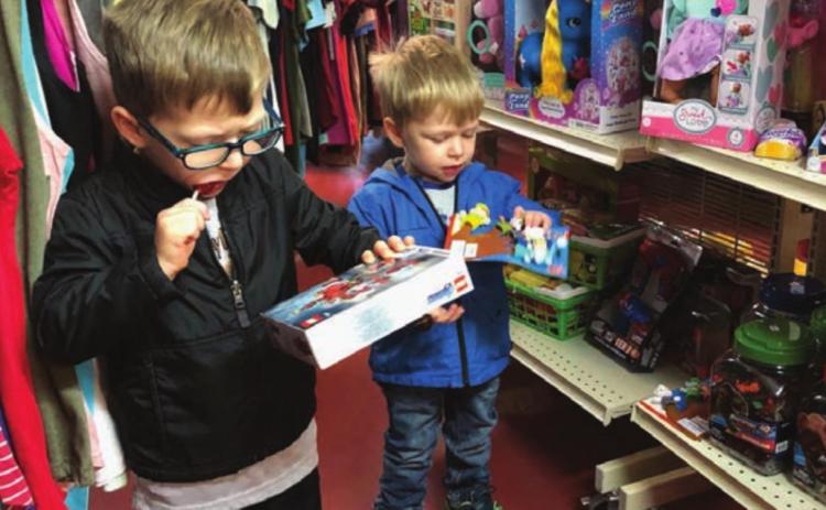 Lincoln and Trevor Aberle and their mom, Melissa, were at Dakota Silk Screen on Monday scouting out the Christmas merchandise. The boys were giving Mom some hints about what to put on their wish lists. They also visited the museum, where they saw lots of dinosaur bones and the T-Rex skull that their great-grandpa Bill Alley discovered.