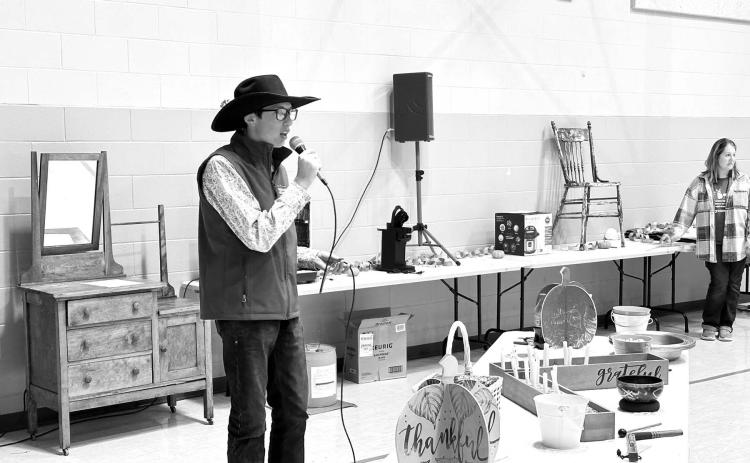 Kade Conner was the auctioneer for the live auction at the Prairie Parish Fall Festival on Sunday, November 5 at Timber Lake. The event also included a ham and turkey dinner with all the trimmings, a bake sale and a silent auction. Prairie Parish is made up of the United Parish of Timber Lake and the UCC at Isabel. Photo by Kathy Nelson
