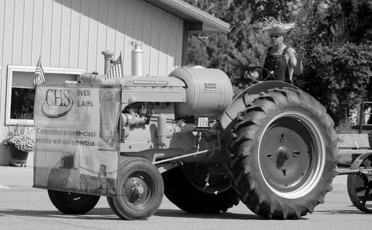 The Best Antique Entry Award at the Timber Lake Days of 1910 Parade went to Kimball and Donna Russell representing CHS River Plains in Isabel with a 1946 Minneapolis Moline tractor. Photo by Jon Flatland