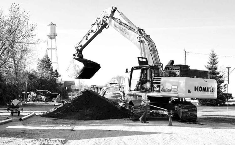 Crow River Construction has resumed work on the Timber Lake City Water Project. Above, the construction crew digs to install new lines on E Street. Photo by Kathy Nelson