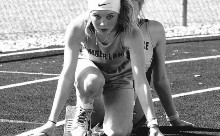 Timber Lake’s Kenlea Heck stays focused on the track ahead of her as she lines up for the start of the 800 meter relay during recent track meet action. Heck and teammates Arianna Bieber, Sara Keller and Kiya Mowrer won the LMC title in the event on Monday in Lemmon. Courtesy Photo