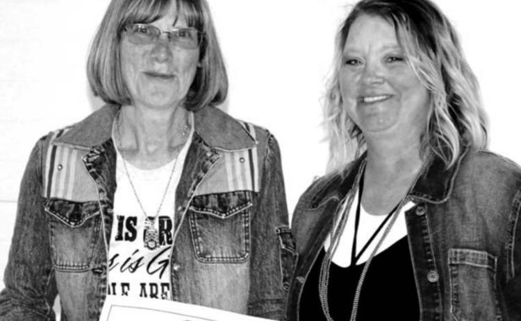 Past DHS Alumni Board member Cindy Longbrake (LEFT) receiving recognition for her many years of service to the DHS Alumni Assoc from DHS Alumni Board member Robyn DePoy..
