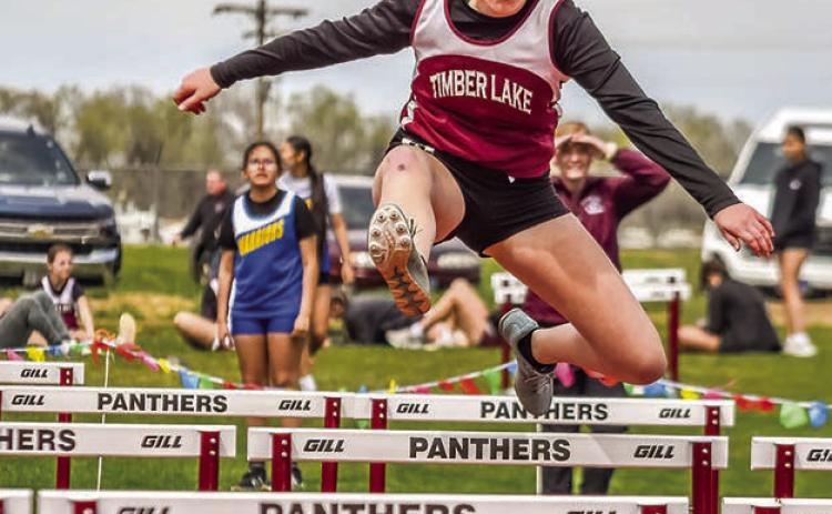 Eighth grader Evelyn Gill sales over a barrier in the 200 meter hurdles at the Timber Lake JV Track Invite last week. Gill took top honors in the event with a time of 37.32 seconds Photo by Marie DuPreez