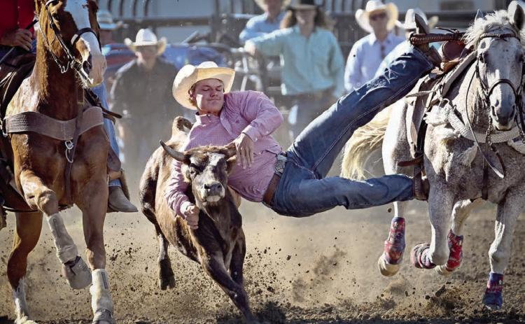 Braydon Terveen-Smith of Lantry, a member of the Dupree High School Rodeo Club, improved his time each time out of the gate to win the South Dakota State High School steer wrestling championship last weekend in Ft. Pierre. Terveen-Smith, a 2025 graduate of Dupree High School, also qualified for the National High School Finals Rodeo slated July 13-19 in Rock Springs, WY. Photo courtesy of Chuck Miner