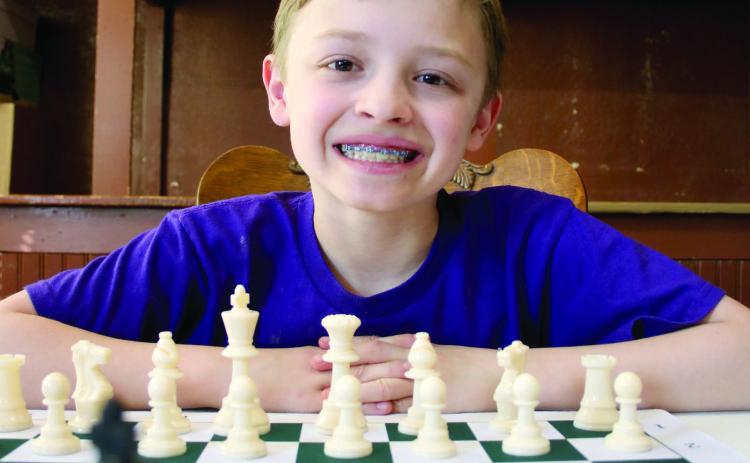 Ben Mareska, 10, took up the game of chess about a year-and-a-half ago after learning how to play the game watching YouTube videos. Today, the Timber Lake Elementary School fourth grader is halfway to becoming a Grand Master, the highest level of player aside from World Champion. Photo by Jon Flatland