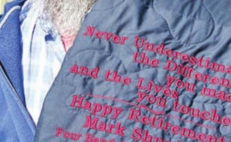 Mark Shupick was presented with a star quilt recognizing his years with Four Bands Community Fund.