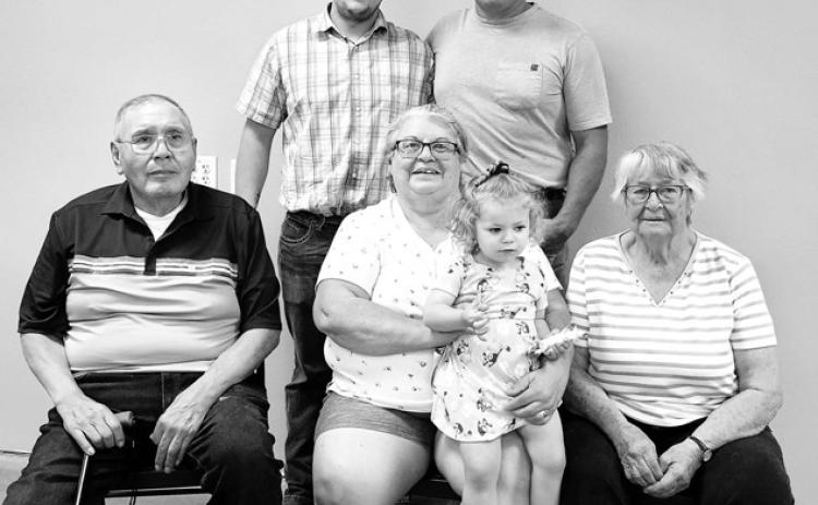 Baby Hope Gracelyn Schuchhardt–Hoyt, held by great-grandma Ethel Hill, is the fifth generation of her family. At right is great-great-grandma Estelle Cook. In back are Teigan Schuchhardt (father) and Adam Schuchhardt (grandfather). At right is Ethel’s husband, John Hill.