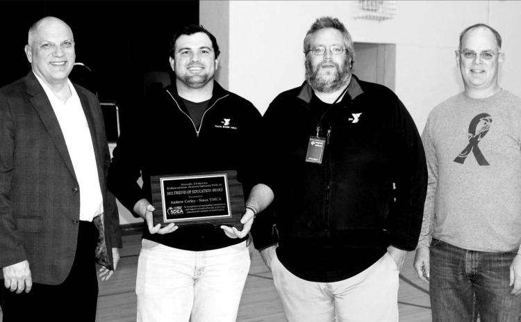 L-R are Loren Paul, SDEA president; Andrew Corley, Sioux YMCA CEO; Mark Barron, YMCA Senior Youth Involvement Director; and Shawn Olsen, who nominated the Sioux YMCA for the Friend of Education Award.