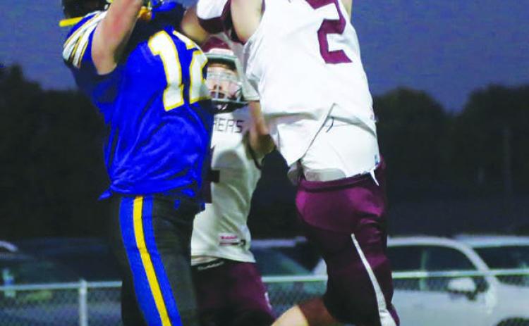 Cole Ducheneaux (2) outleaps Castlewood receiver Jackson Schofield (12) to intercept a pass in the end zone during Timber Lake’s 26-0 loss to the Warriors in the first round of the Class 9A football playoffs last Thursday, Oct. 20. Giving defensive help on the back side is Gracen Hansen. Photo courtesy of LeeAnne Dufek, Hamlin Co. Publishing
