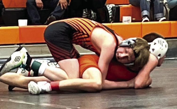 Taggen Paxton (top) works against an opponent during recent McLaughlin-Timber Lake wrestling action. Paxton won top honors at 100-103 pounds at the Ipswich-Bowdle JV Meet on Jan. 22. Photo by Denise Perryman