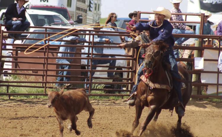 Left, Hayes Burress of Isabel throws his loop while competing in the calf roping event at the South Dakota High School Rodeo Association’s Northwest Region Rodeo on Saturday, and Sunday, June 14-15, in Dupree. Burress qualified for the State HS Finals Rodeo in calf roping and team roping. Photo by Jon Flatland