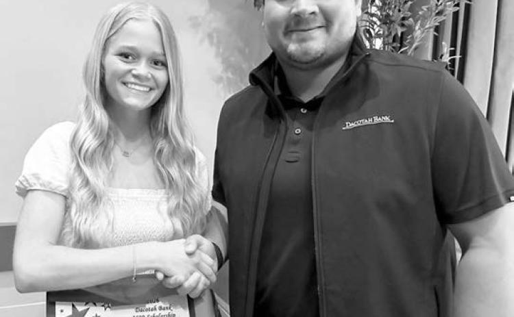 For over 30 years, Dacotah Bank has offered scholarships to high school seniors whose families are customers of Dacotah Bank and Dacotah Insurance. Over $70,000 in scholarships were awarded this year throughout South Dakota, North Dakota, and Minnesota. Timber Lake senior Hailey Roggow (left) was presented with a $2,000 scholarship by Senior Ag Banker Fred Vogel (right) from the Dacotah Bank in Mobridge.