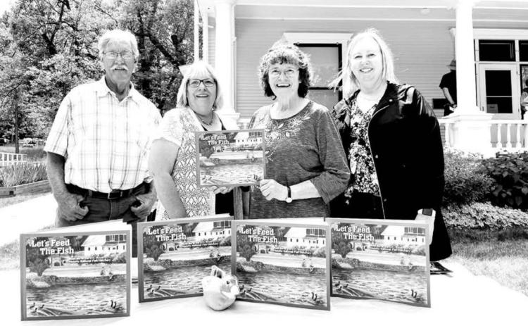 The “Let’s Feed the Fish - Meet Me at the D.C. Booth Historic National Fish Hatchery” book was published by the Booth Society, the nonprofit friends group of the hatchery. Pictured L-R are Illustrator Bill Feterl and authors Karen Holzer, Joanna Jones and Kindra Gordon.