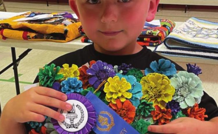 Isaac Schweitzer won the Grand Champion ribbon for creative hobbies in the open class.