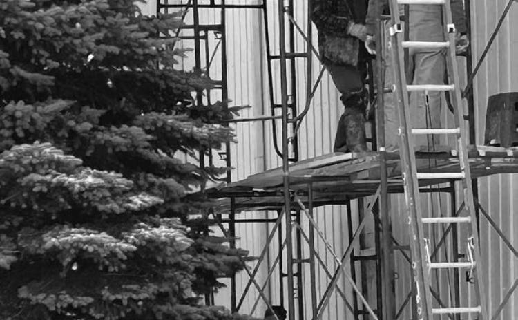 Rusty Simon and his crew braved snow and cold temperatures last week to make repairs to the outer tin on a portion of the Isabel Community Center.