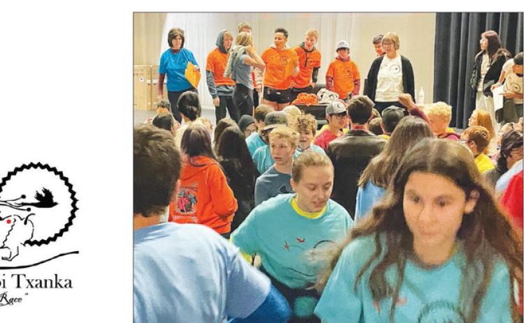 Middle and high school students took off from the theater after receiving their assigned T-shirts and leaders.