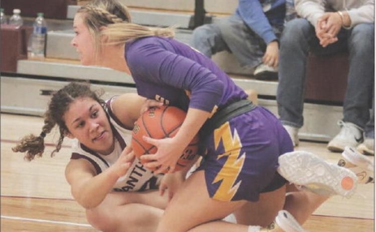 Timber Lake sophomore forward Jasmine Nash (left) and Dupree senior guard RaeLynn Vines battle on the floor for possession of a loose ball during non-conference girls’ basketball action between the Lady Panthers and Lady Tigers last Tuesday, Jan. 31, in Timber Lake. Dupree held off a late rally to defeat Timber Lake 50-42, handing the Lady Panthers just their third loss of the season. For more game coverage, turn to Page 5B. Photo by Jon Flatland