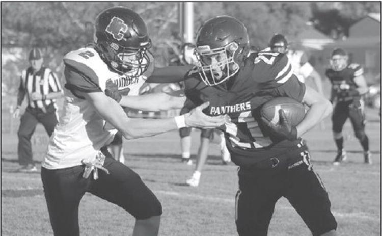 Timber Lake wide receiver Eddie Keller stiff-arms a would be North Central defender during football action at Kraft Field last Friday, Sept. 6. Keller shed the tackler and turned this short reception from quarterback Cole Ducheneaux into a 50-plus yard touchdown. Photo by Jon Flatland